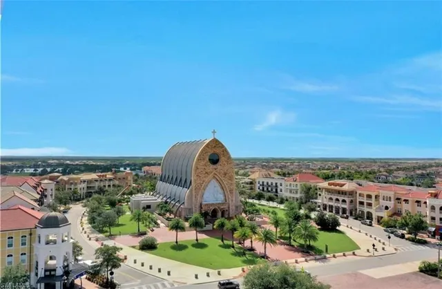 a room with furniture a flat screen tv and a large window