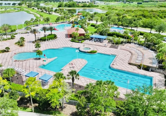 a view of a swimming pool with a patio
