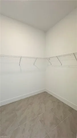 a kitchen with stainless steel appliances a refrigerator sink and microwave