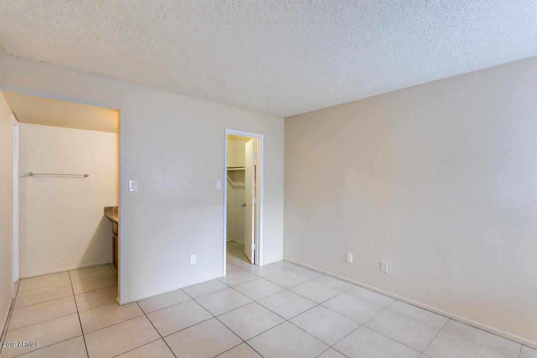 4410 North Longview Avenue, Unit 106 Phoenix, AZ 85014 - Photo 15 of 25 a view of an empty room and window