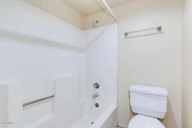 a view of a porch with a small garden