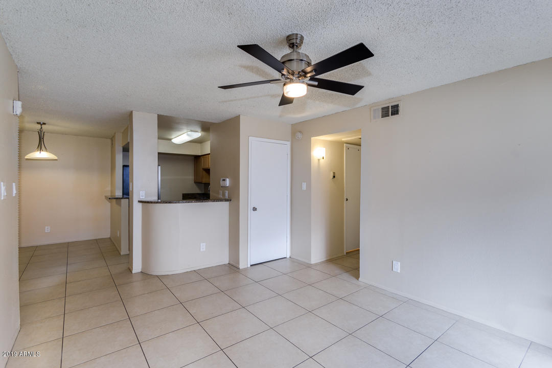 4410 North Longview Avenue, Unit 106 Phoenix, AZ 85014 - Photo 7 of 25 a view of a kitchen with a sink and a refrigerator