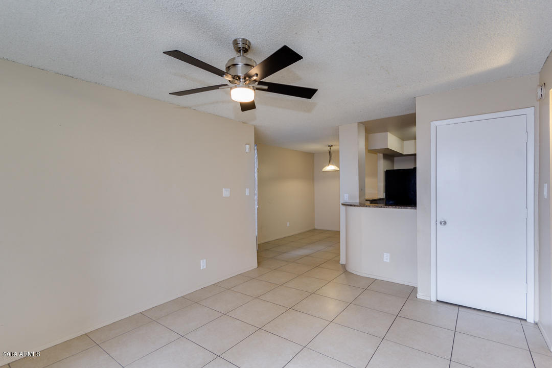 4410 North Longview Avenue, Unit 106 Phoenix, AZ 85014 - Photo 8 of 25 a view of a livingroom with a kitchen