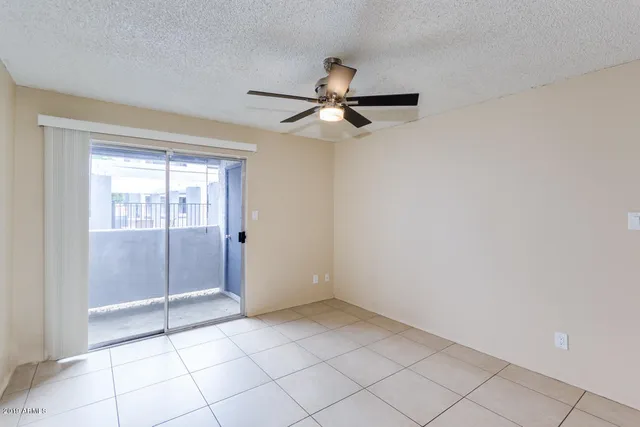 a kitchen with granite countertop a stove and a refrigerator