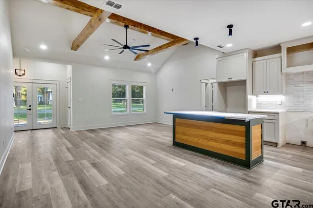 a bedroom with furniture and window