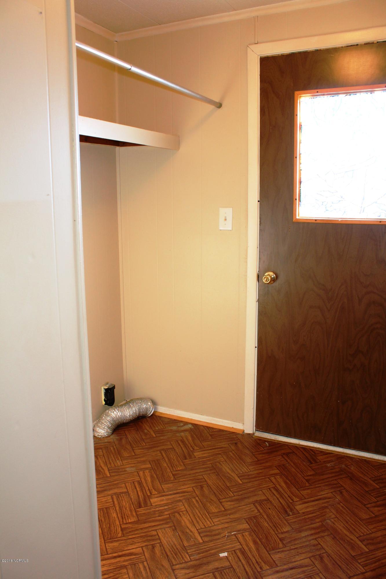 1491 East Old Spring Hope Road Nashville, NC 27856 - Photo 17 of 21 Utility room with back door