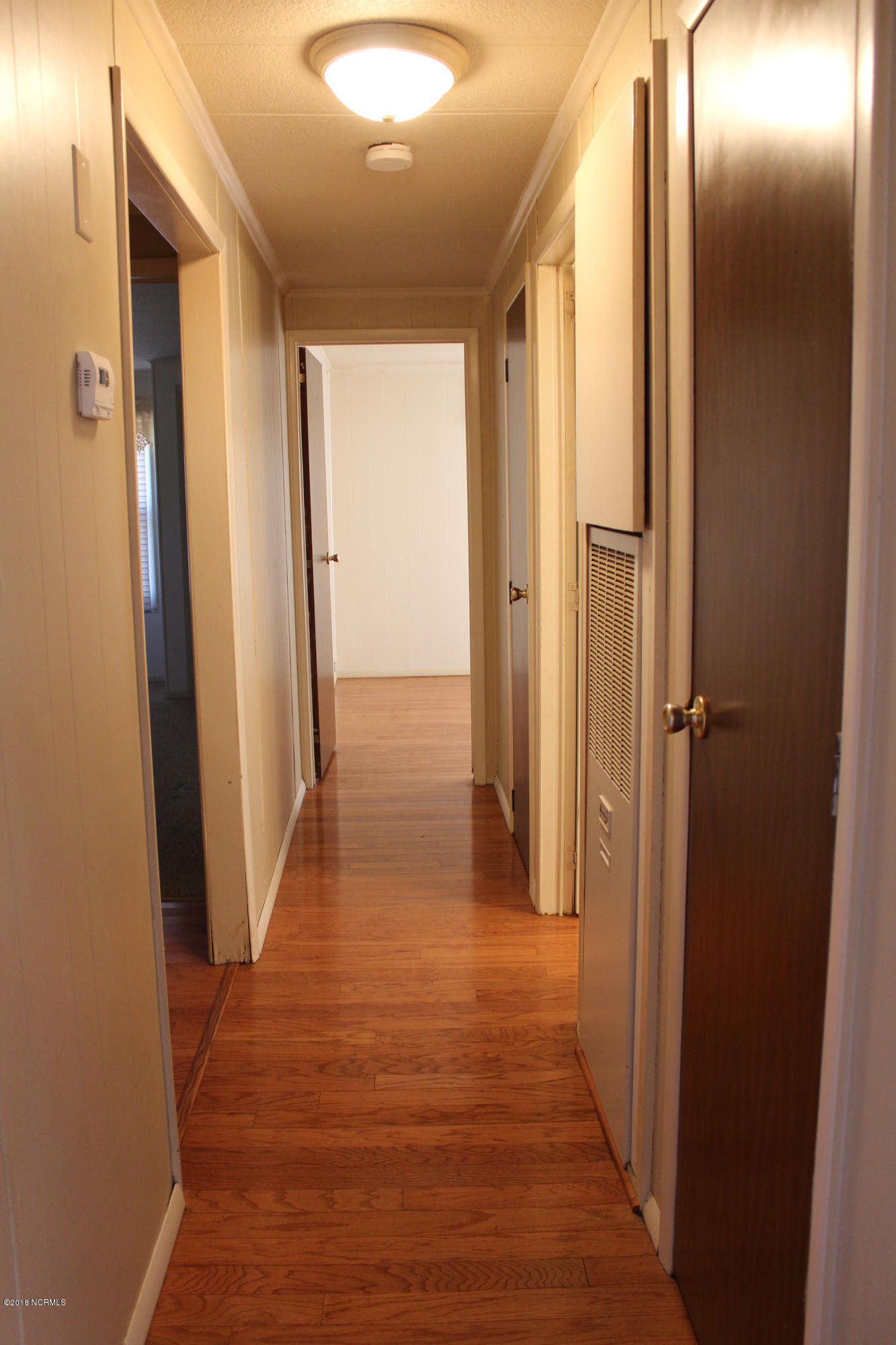 1491 East Old Spring Hope Road Nashville, NC 27856 - Photo 8 of 21 laminate down hall makes it easy for cleaning