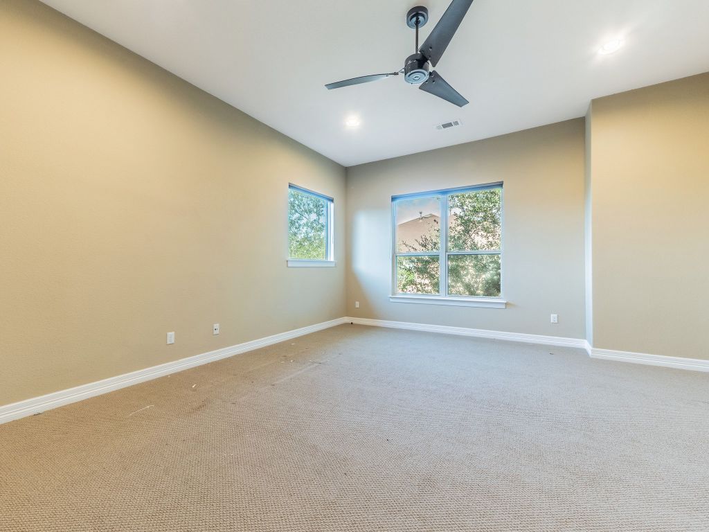 826 San Remo Boulevard Lakeway, TX 78734 - Photo 17 of 25 an empty room with windows