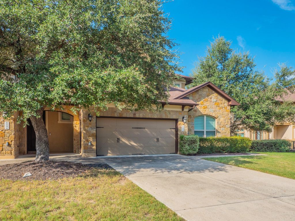 826 San Remo Boulevard Lakeway, TX 78734 - Photo 21 of 25 a front view of a house with a yard