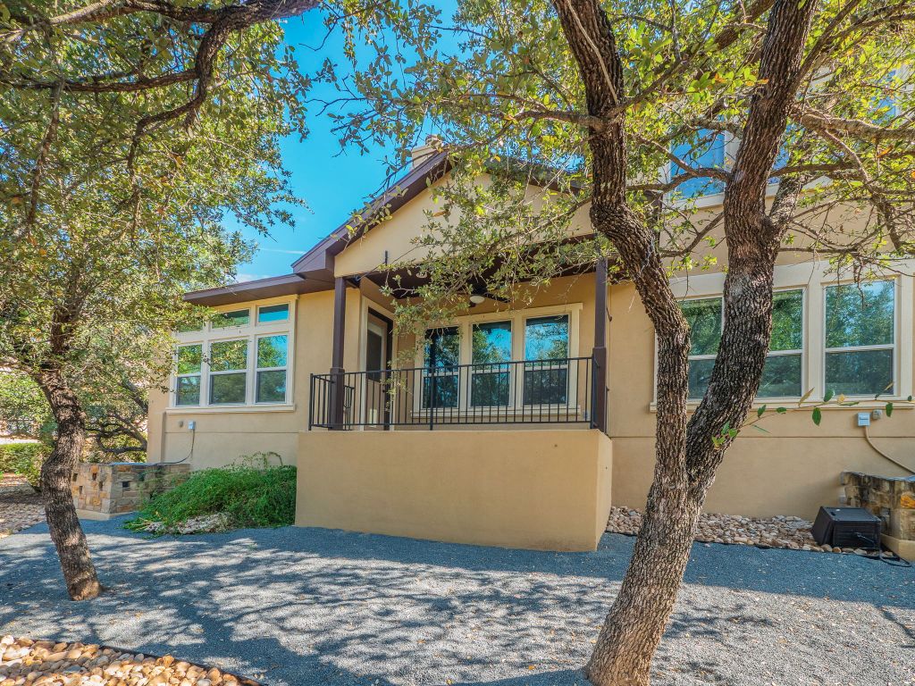 826 San Remo Boulevard Lakeway, TX 78734 - Photo 25 of 25 a view of a house with a tree in front of it
