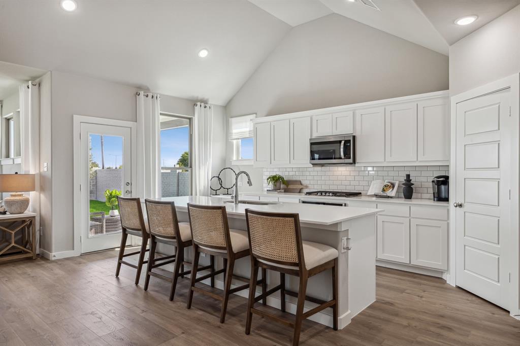 1129 Del Rio Drive Lavon, TX 75166 - Photo 6 of 28 Kitchen in the Wimbledon home plan by Trophy Signature Homes – REPRESENTATIVE PHOTO
