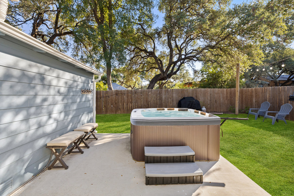 102 Ranchview Drive Johnson City, TX 78636 - Photo 32 of 37 Fenced backyard featuring a hot tub and a patio