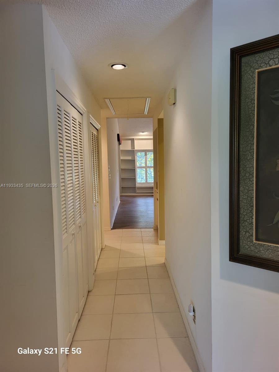 5200 Southeast Seascape Way, Unit 201 Stuart, FL 34997 - Photo 11 of 33 a view of hallway with furniture