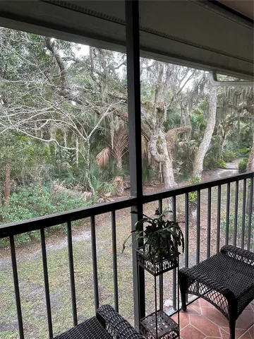 a balcony with wooden floor in outdoor space