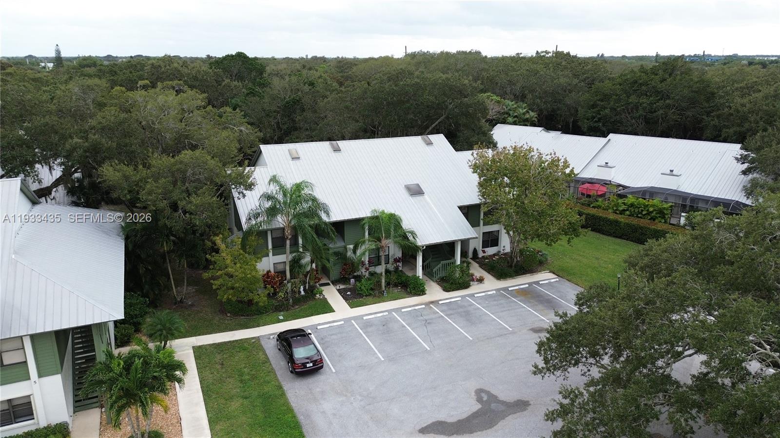 5200 Southeast Seascape Way, Unit 201 Stuart, FL 34997 - Photo 23 of 33 an aerial view of a house with pool garden and mountain view
