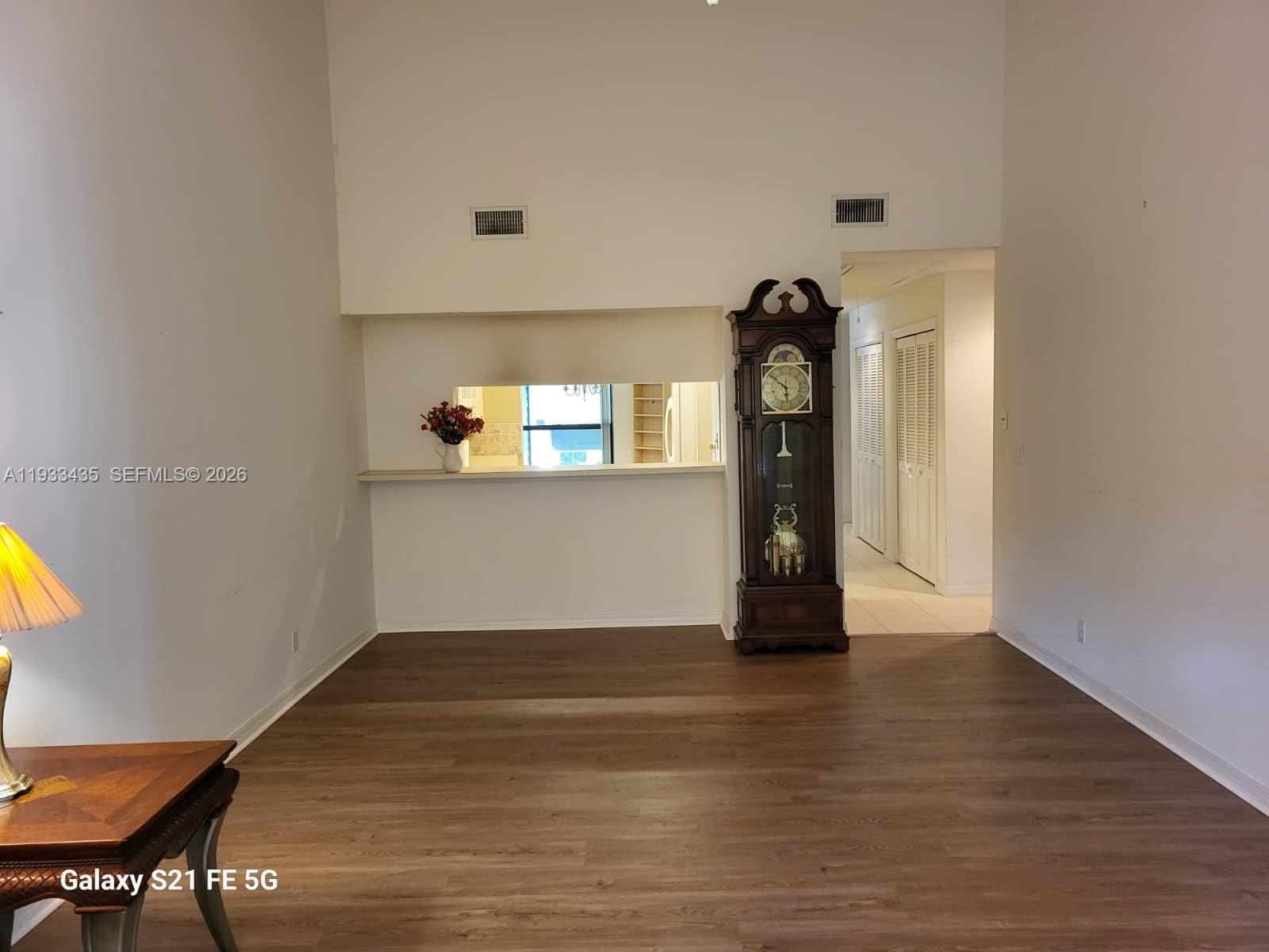 5200 Southeast Seascape Way, Unit 201 Stuart, FL 34997 - Photo 4 of 33 a view of a living room and wooden floor