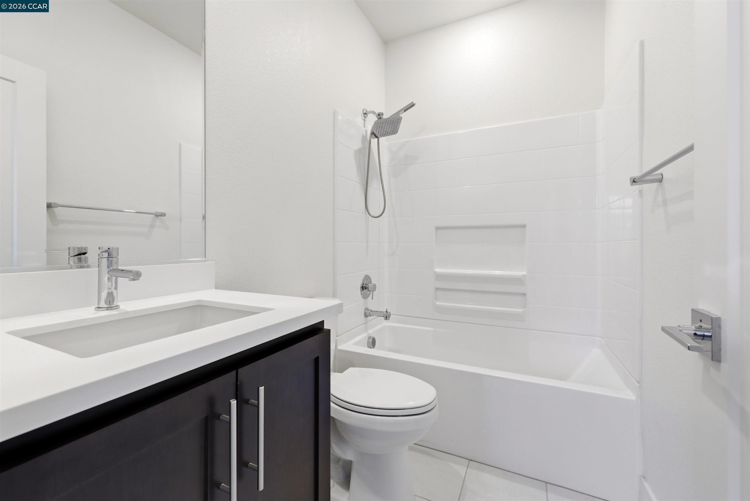 205 Plum Tree Street Livermore, CA 94551 - Photo 10 of 47 a bathroom with a sink a toilet and shower