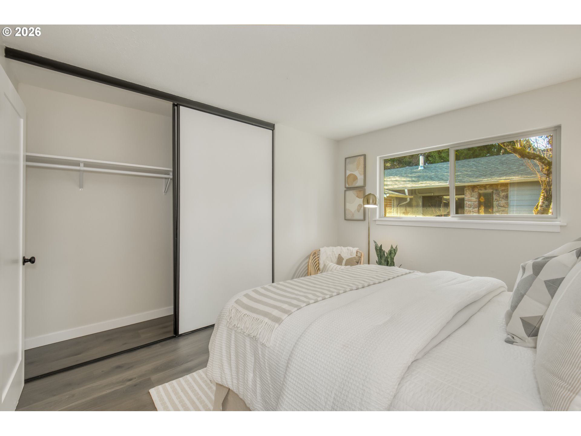 3114 Southwest Carson Street Portland, OR 97219 - Photo 18 of 18 a bedroom with a bed and a window