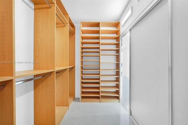 a view of a hallway with washer and dryer