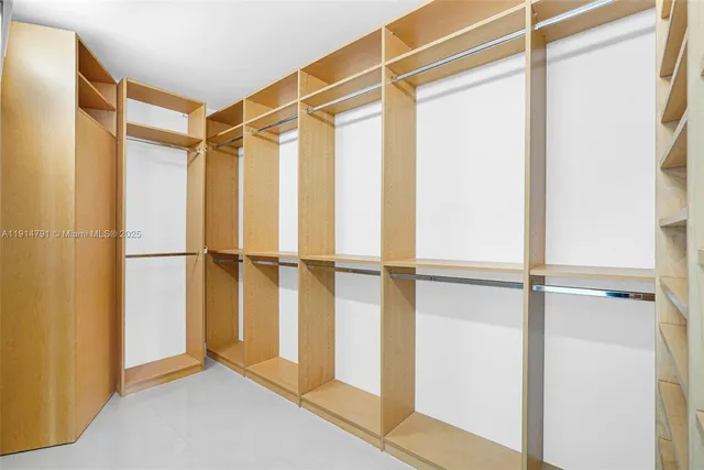 a bathroom with a sink shower and a mirror