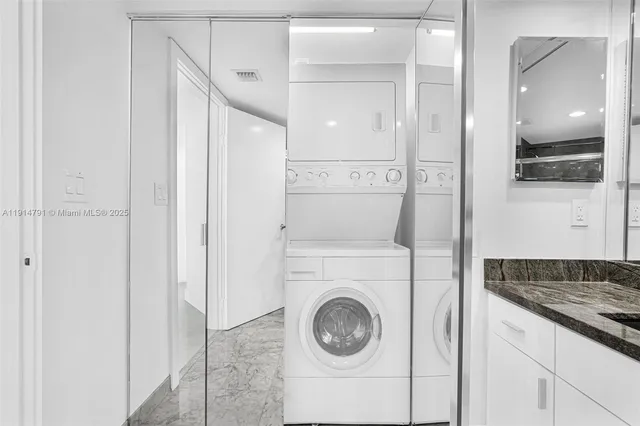 a kitchen with kitchen island a sink appliances and cabinets