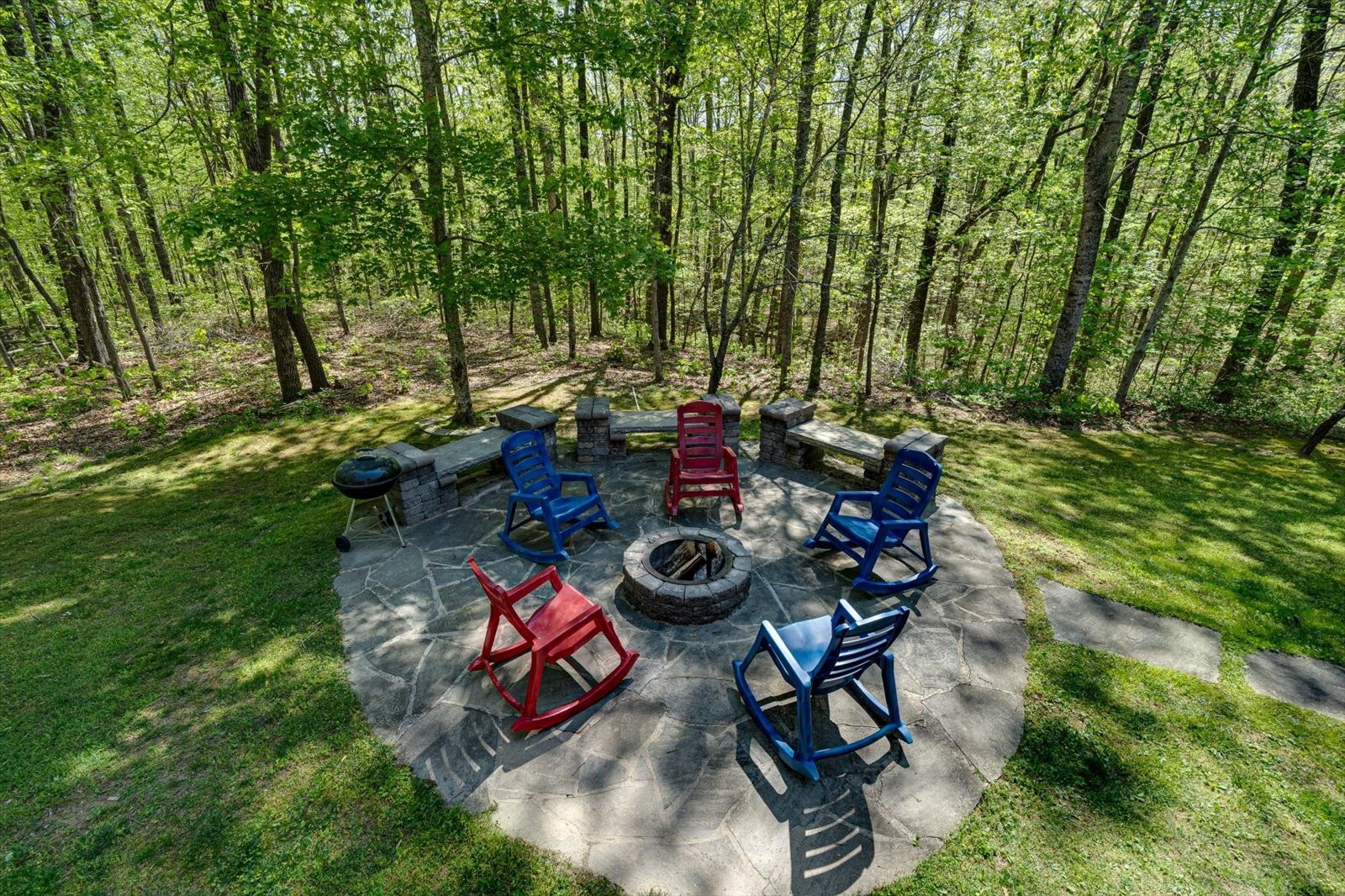 557 Green Forest Road Dunlap, TN 37327 - Photo 17 of 57 a view of a chairs and table in backyard