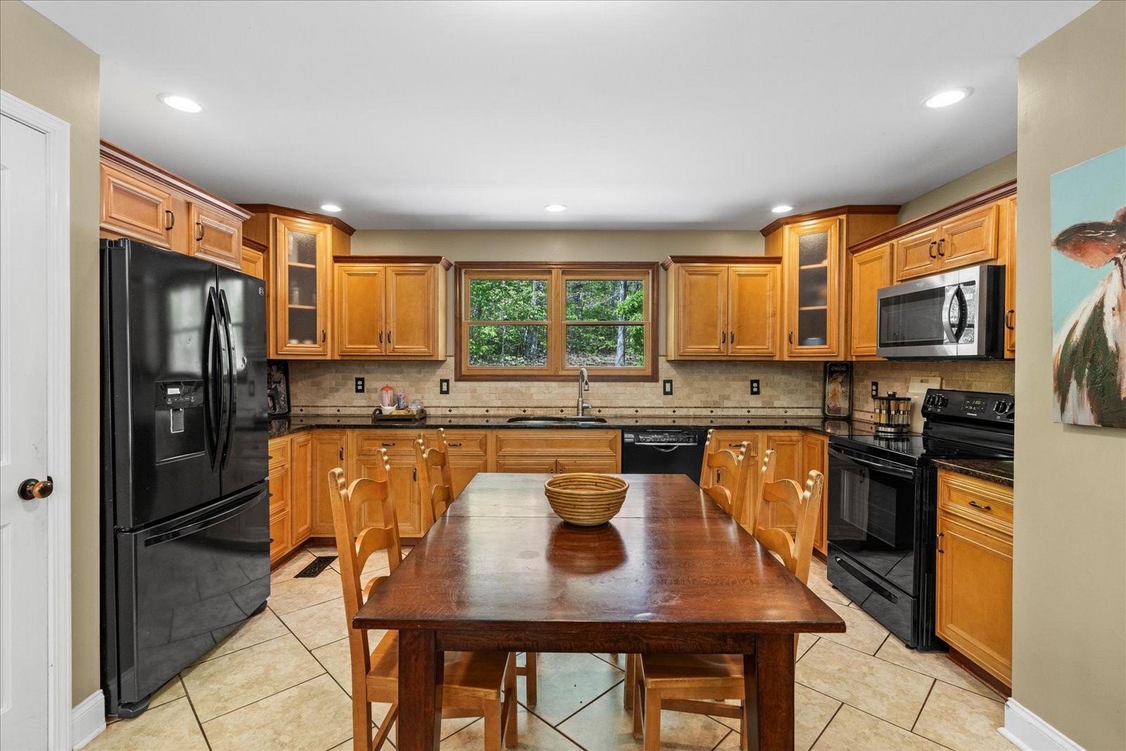557 Green Forest Road Dunlap, TN 37327 - Photo 22 of 57 a kitchen with stainless steel appliances granite countertop a refrigerator a stove top oven a sink dishwasher and cabinets with wooden floor