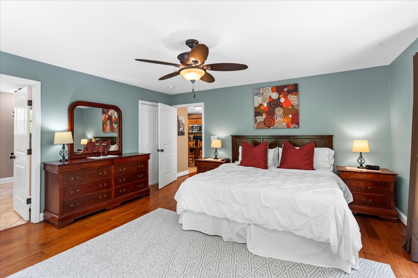 557 Green Forest Road Dunlap, TN 37327 - Photo 27 of 57 a bedroom with a bed and a chandelier