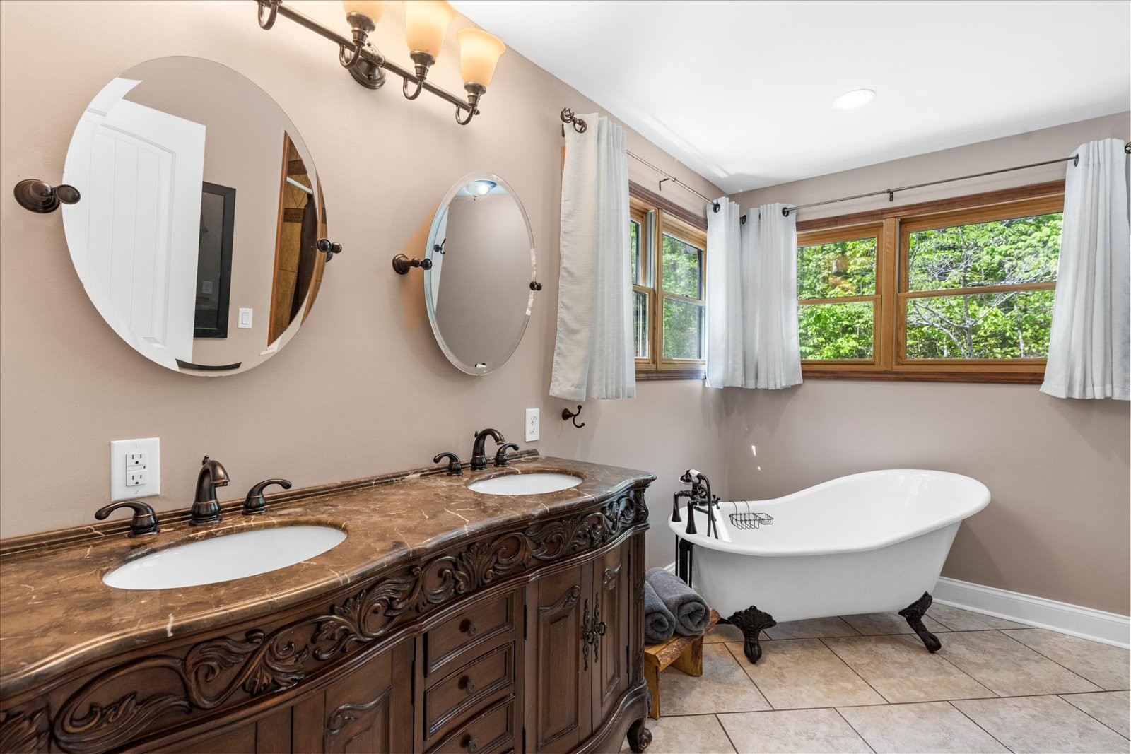 557 Green Forest Road Dunlap, TN 37327 - Photo 28 of 57 a bathroom with a double vanity sink and a mirror