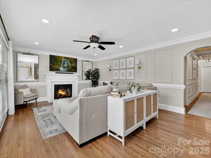 a view of a living room kitchen and a fireplace