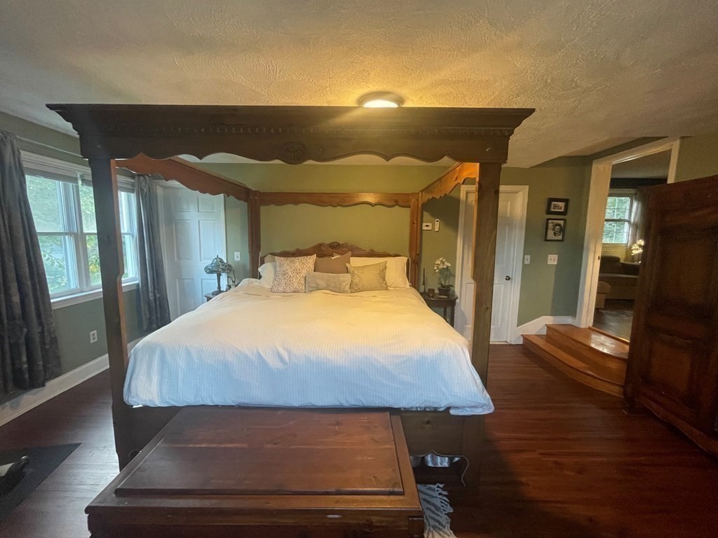 75 Blake Road Wrentham, MA 02093 - Photo 11 of 24 a bedroom with a bed and wooden floor