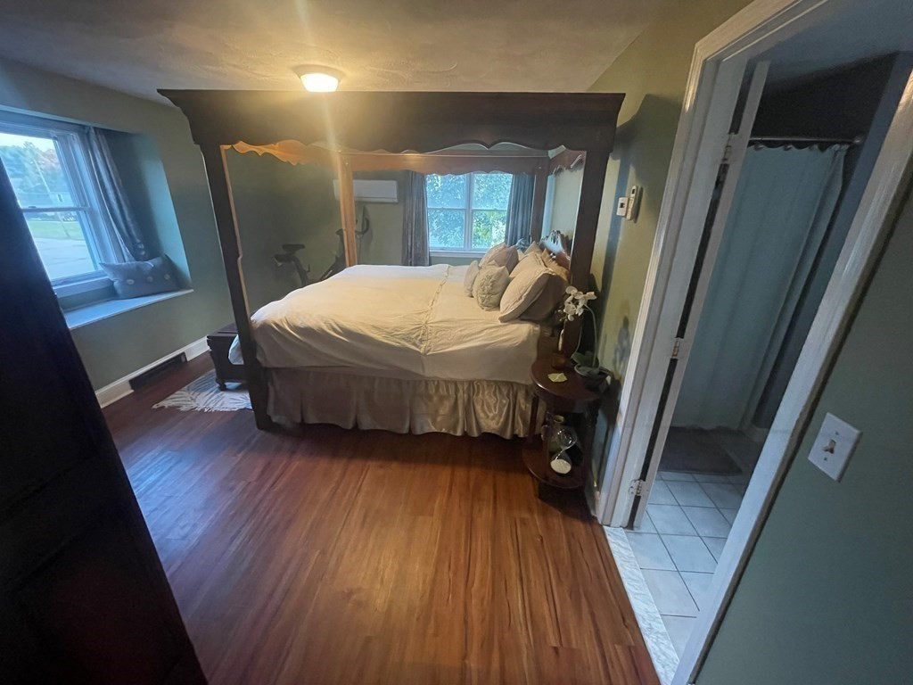 75 Blake Road Wrentham, MA 02093 - Photo 12 of 24 a bedroom with a bed and a mirror