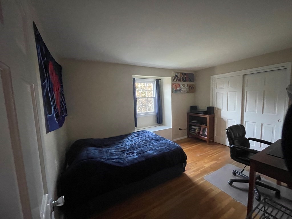 75 Blake Road Wrentham, MA 02093 - Photo 15 of 24 a bedroom with a bed and a workspace
