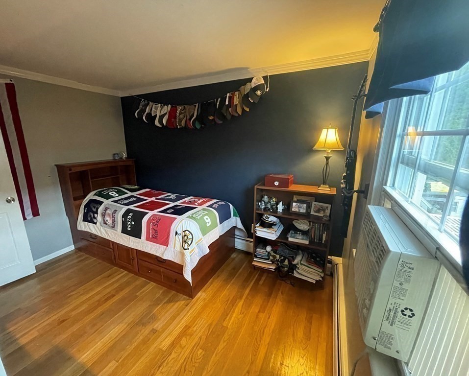 75 Blake Road Wrentham, MA 02093 - Photo 17 of 24 a bedroom with a bed and a wooden floor