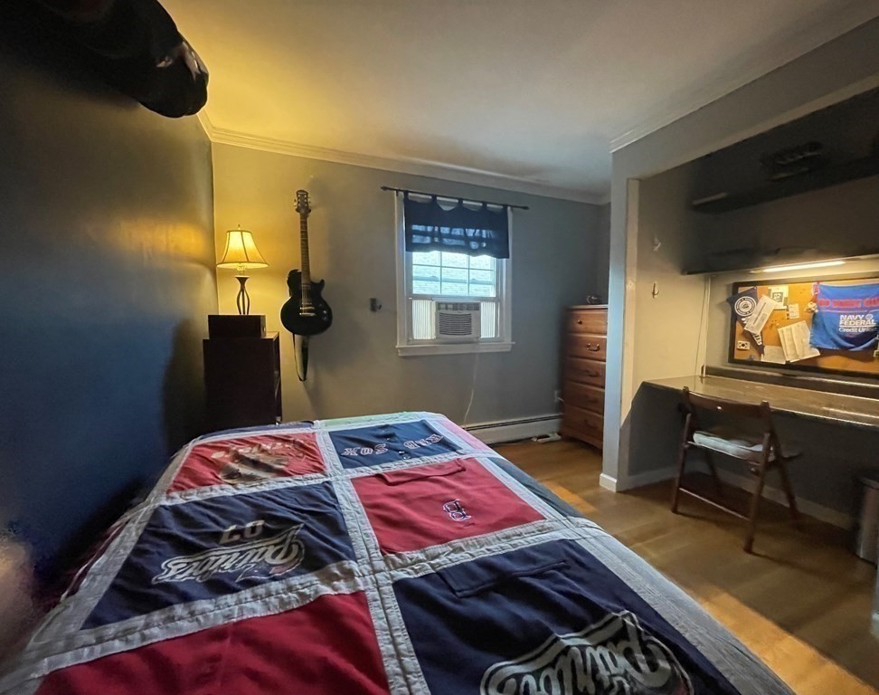 75 Blake Road Wrentham, MA 02093 - Photo 18 of 24 a bedroom with a bed and wooden floor