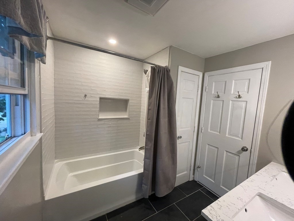 75 Blake Road Wrentham, MA 02093 - Photo 19 of 24 a bathroom with a shower and a tub