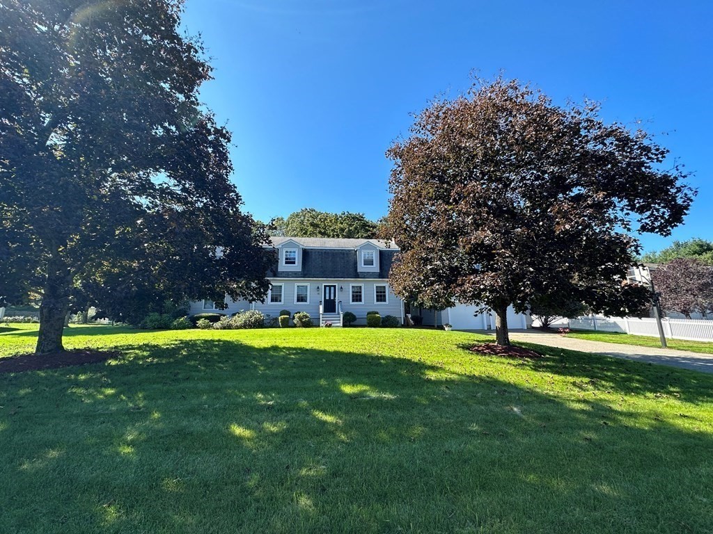 75 Blake Road Wrentham, MA 02093 - Photo 2 of 24 a swimming pool with outdoor seating and yard