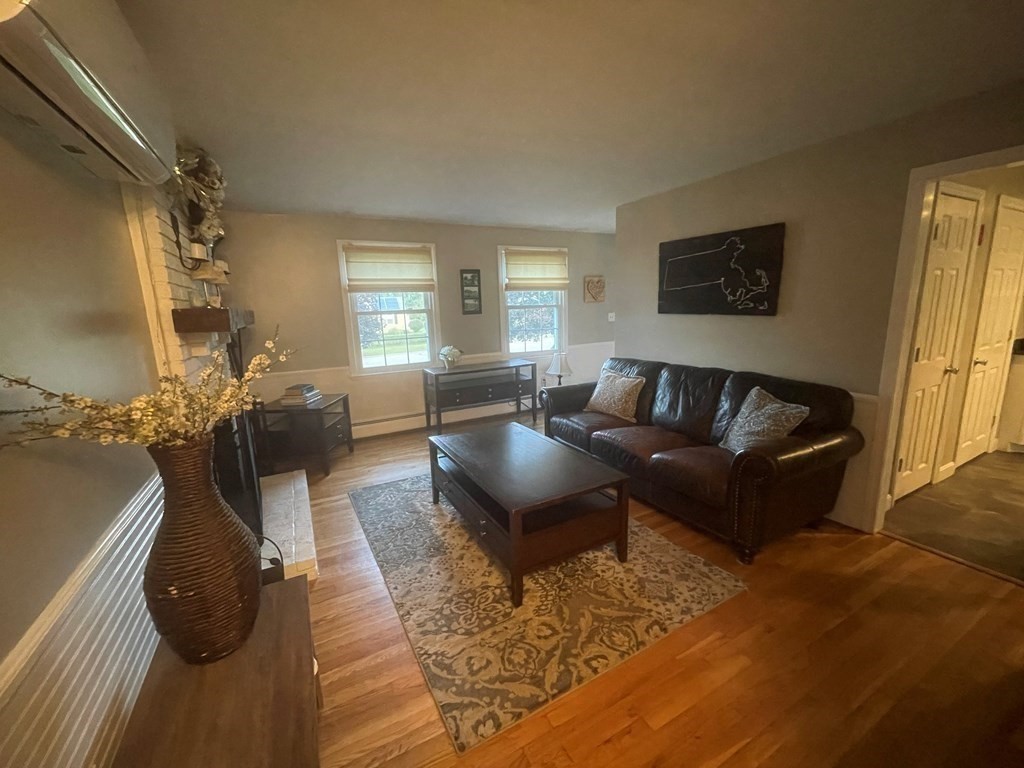75 Blake Road Wrentham, MA 02093 - Photo 6 of 24 a living room with furniture and a flat screen tv