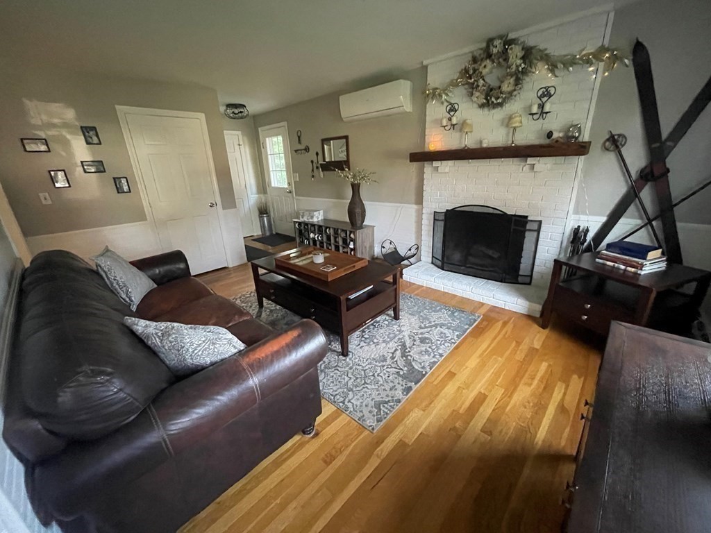 75 Blake Road Wrentham, MA 02093 - Photo 7 of 24 a living room with furniture and a fireplace