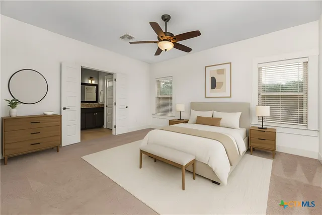 a bedroom with a bed and window