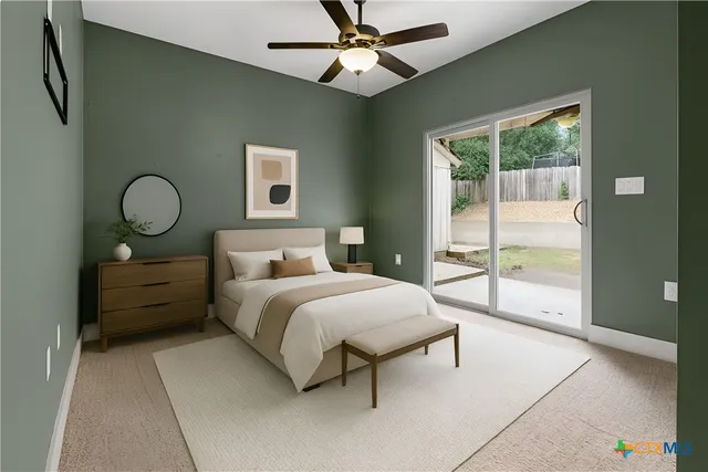 a bedroom with a bed and large window