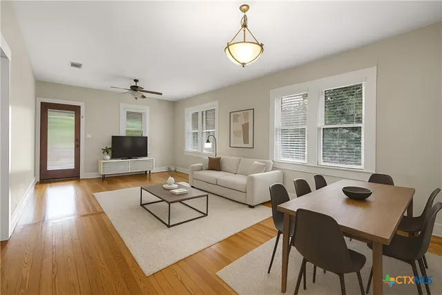 a living room with furniture and a table