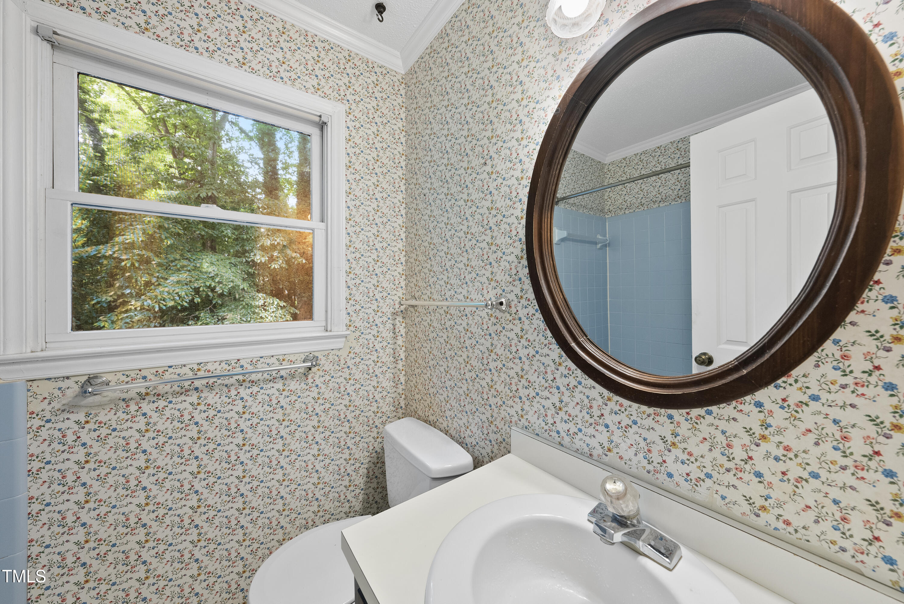 3517 Eden Croft Drive Raleigh, NC 27612 - Photo 18 of 22 a bathroom with a sink and a mirror