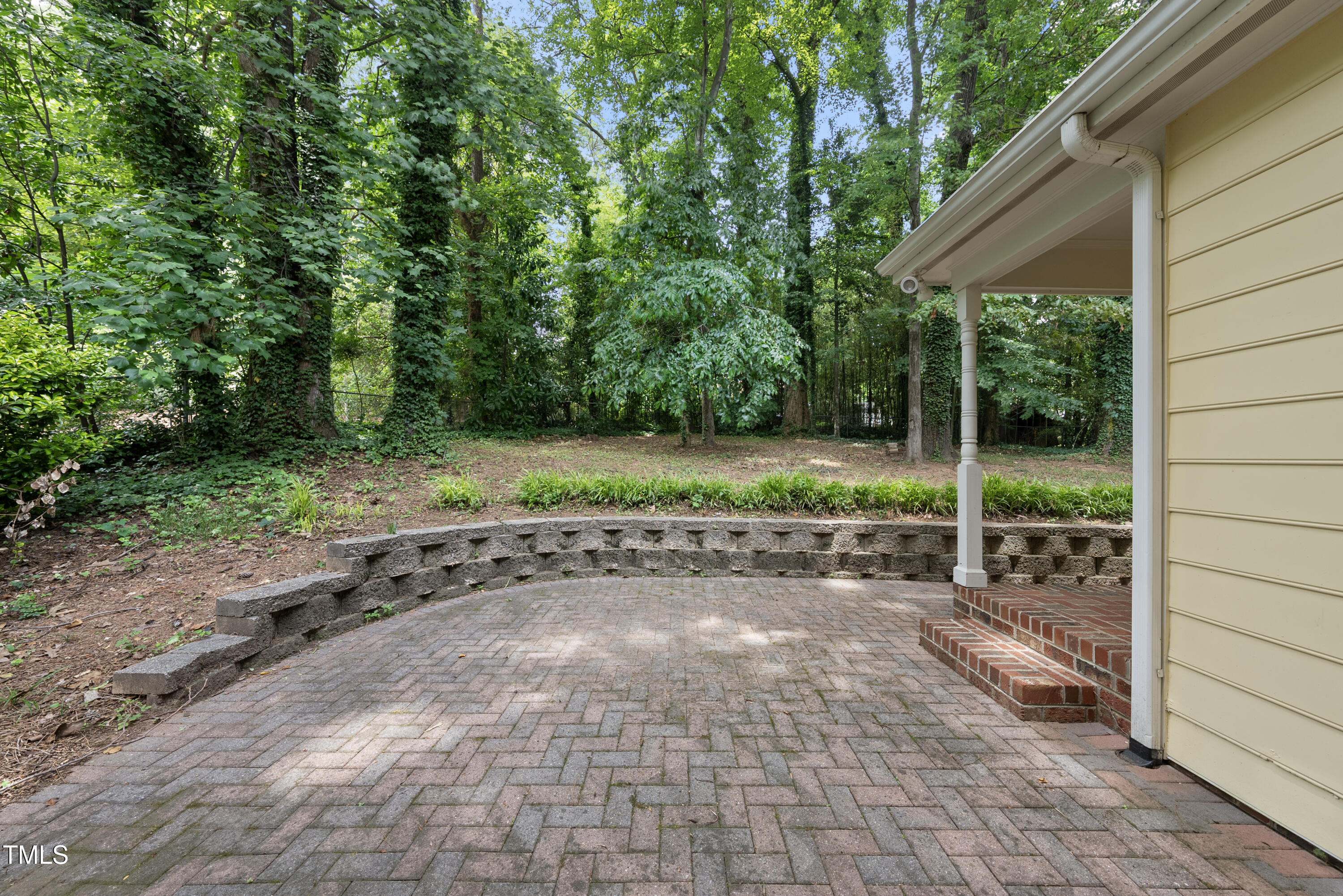 3517 Eden Croft Drive Raleigh, NC 27612 - Photo 20 of 22 a view of a yard with a wooden fence