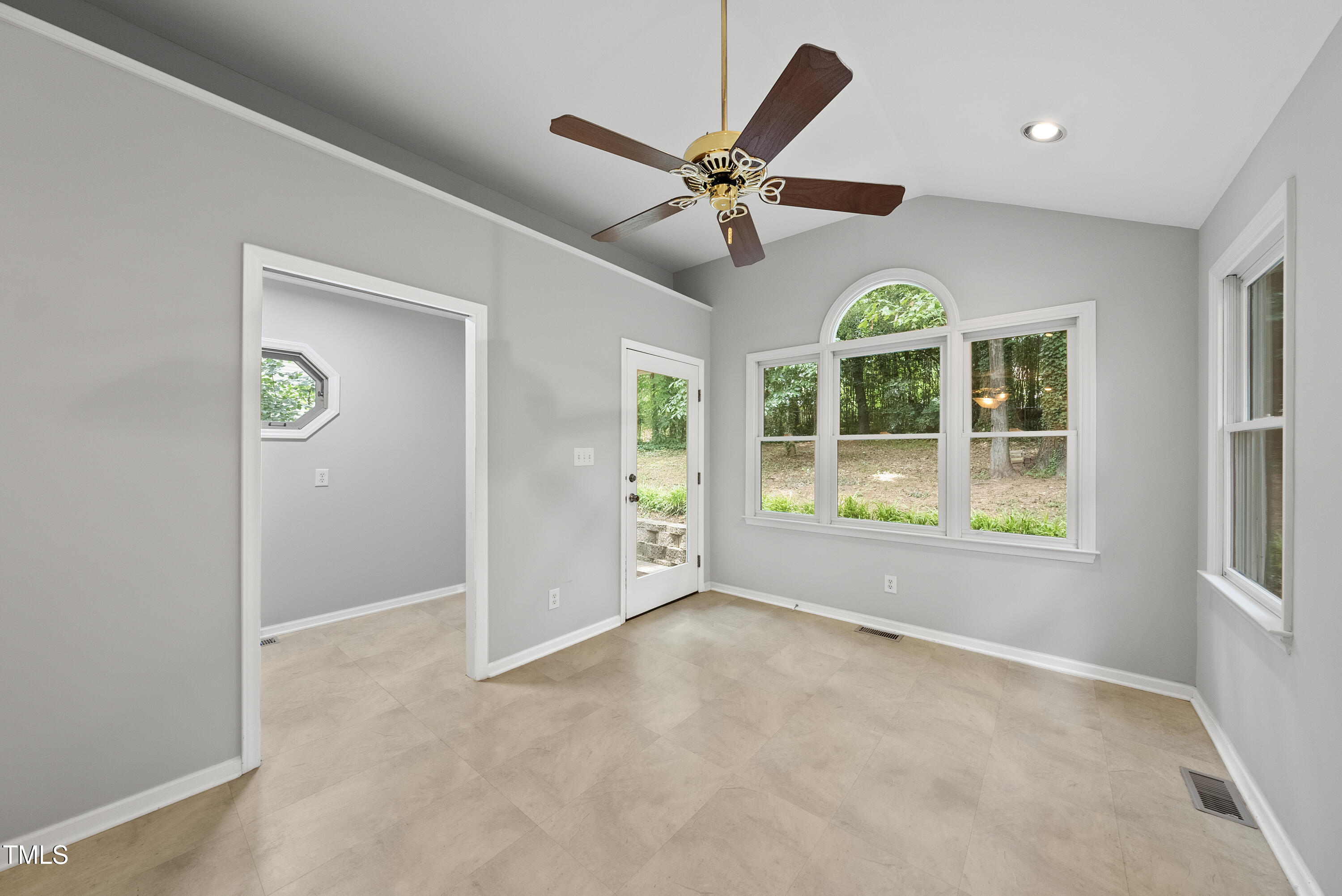 3517 Eden Croft Drive Raleigh, NC 27612 - Photo 8 of 22 an empty room with windows and fan