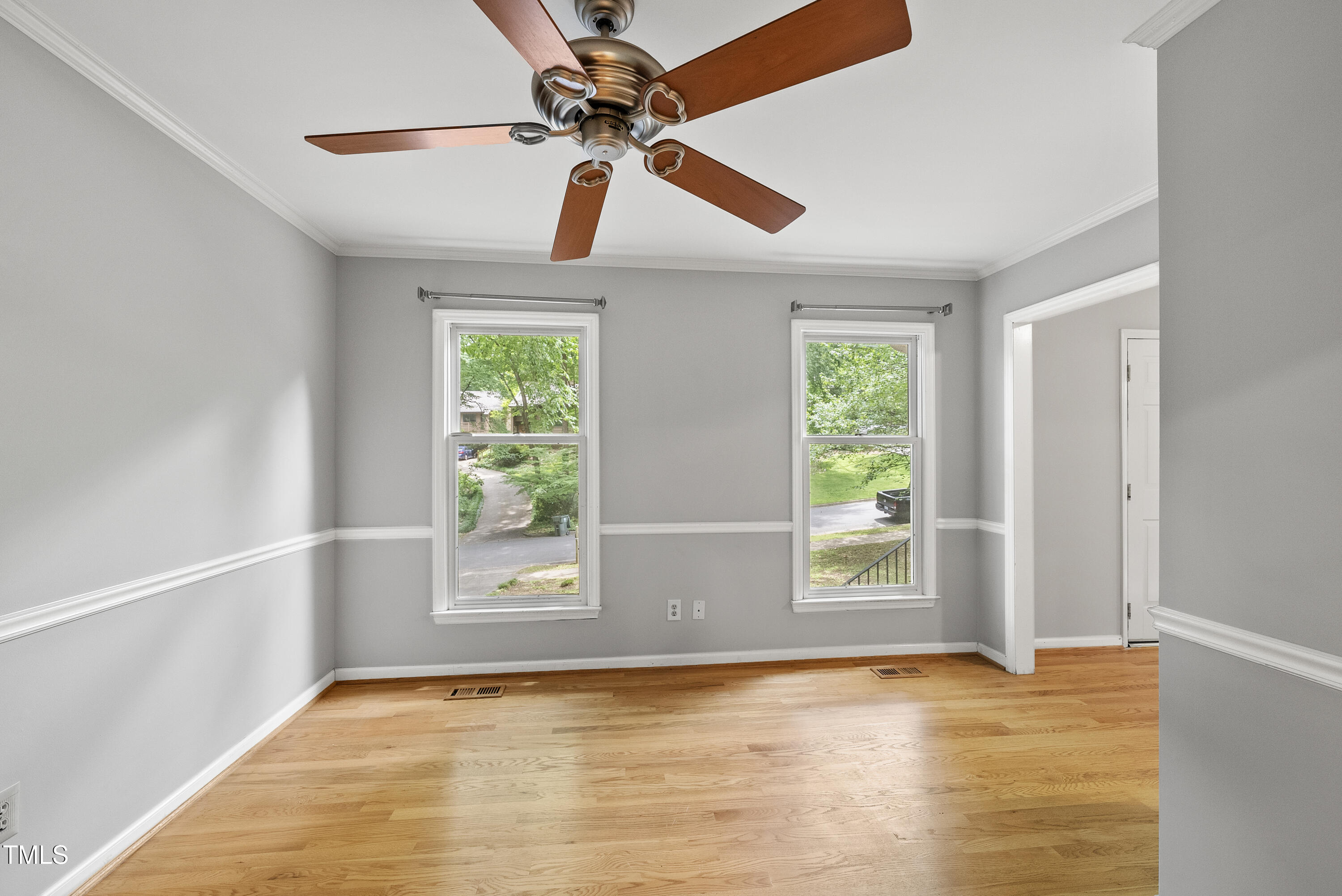 3517 Eden Croft Drive Raleigh, NC 27612 - Photo 10 of 22 a view of an empty room with window and chandelier fan