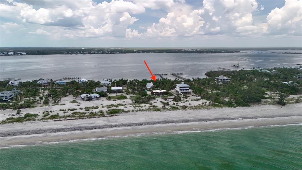 9144 Carter Street Placida, FL 33946 - Photo 4 of 19 a view of a lake with a yard