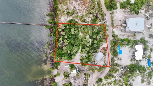 an aerial view of a house with a yard and garden