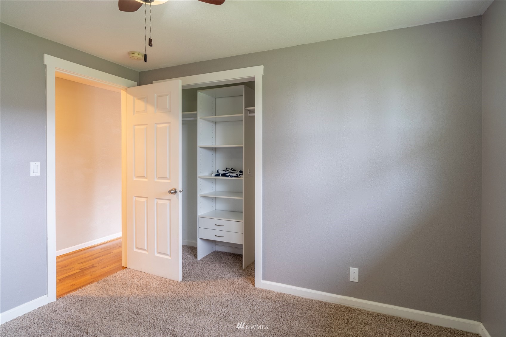383 Maringo Road Ephrata, WA 98823 - Photo 14 of 29 an empty room with closet and a chandelier fan