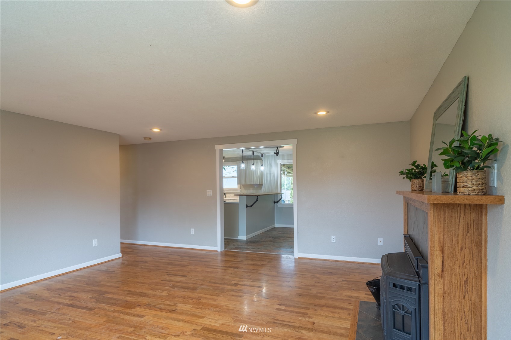383 Maringo Road Ephrata, WA 98823 - Photo 3 of 29 a view of an empty room with wooden floor and a window
